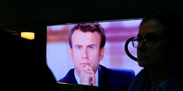 French presidential election candidate for the En Marche ! movement Emmanuel Macron is pictured on a television screen backstage, seconds before the start of a live brodcast televised debate in television studios of French public national television channel France 2, and French private channel TF1 in La Plaine-Saint-Denis, north of Paris, on May 3, 2017 as part of the second round election campaign.Pro-EU centrist Emmanuel Macron and far-right leader Marine Le Pen face off in a final televised debate on May 3 that will showcase their starkly different visions of France's future ahead of this weekend's presidential election run-off. / AFP PHOTO / POOL / Eric FEFERBERG (Photo credit should read ERIC FEFERBERG/AFP/Getty Images)