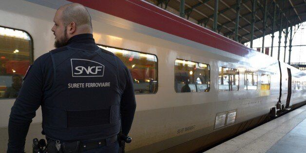 Police officers patrol the Thalys railway platform on December 21, 2015 at the Gare Du Nord train station in Paris. The Gare du Nord train station in Paris on December 20 began using security gates and baggage scanners for passengers taking the Thalys high-speed rail system serving Belgium and the Netherlands, SNCF chief Guillaume Pepy said. / AFP / BERTRAND GUAY (Photo credit should read BERTRAND GUAY/AFP/Getty Images)