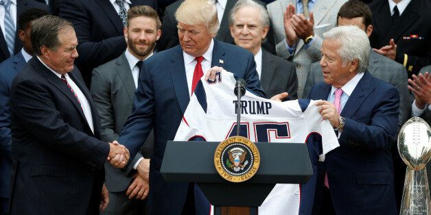 U.S. President Donald Trump shakes hands with Head Coach Bill Belichick (L) and CEO of the New England Patriots Robert Kraft during an event honoring the Super Bowl champion New England Patriots at the White House in Washington, U.S., April 19, 2017. REUTERS/Joshua Roberts