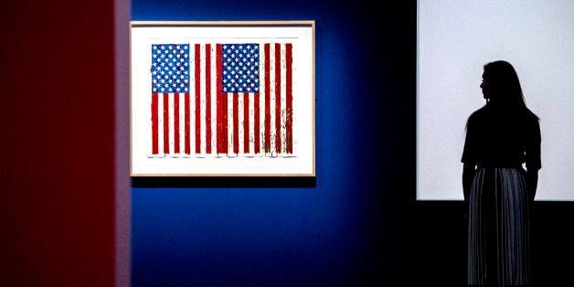 File photo dated 06/03/17 of a member of staff observing Flags I 1973 by Jasper Johns, one of the 200 American prints from the 1960s to the modern day unveiled at the British Museum, London, during a photo call ahead of The American Dream: Pop To The Present exhibition launch on March 9.