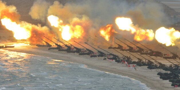 Artillery pieces are seen being fired during a military drill at an unknown location, in this undated photo released by North Korea's Korean Central News Agency (KCNA) on March 25, 2016. REUTERS/KCNA ATTENTION EDITORS - THIS PICTURE WAS PROVIDED BY A THIRD PARTY. REUTERS IS UNABLE TO INDEPENDENTLY VERIFY THE AUTHENTICITY, CONTENT, LOCATION OR DATE OF THIS IMAGE. FOR EDITORIAL USE ONLY. NOT FOR SALE FOR MARKETING OR ADVERTISING CAMPAIGNS. THIS PICTURE IS DISTRIBUTED EXACTLY AS RECEIVED BY REUTERS, AS A SERVICE TO CLIENTS. NO THIRD PARTY SALES. SOUTH KOREA OUT. NO COMMERCIAL OR EDITORIAL SALES IN SOUTH KOREA TPX IMAGES OF THE DAY