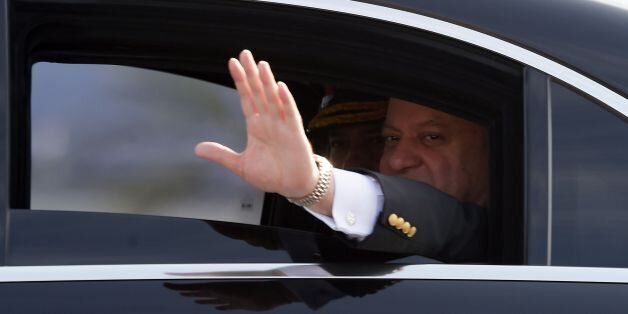 Pakistan's Prime Minister Nawaz Sharif waves as he arrives at the venue for a Pakistan Day military parade in Islamabad on March 23, 2017.Pakistan National Day commemorates the passing of the Lahore Resolution, when a separate nation for the Muslims of The British Indian Empire was demanded on March 23, 1940. / AFP PHOTO / AAMIR QURESHI (Photo credit should read AAMIR QURESHI/AFP/Getty Images)