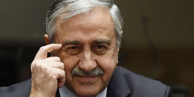 Turkish Cypriot leader Mustafa Akinci gestures during a press conference on UN-sponsored Cyprus peace talks on January 13, 2017 at the Unites Nations headquarters in Geneva.Hopes for a peace deal in Cyprus stalled on January 13, 2017 over a decades-old dispute, with the rival sides at loggerheads over the future of Turkish troops on the divided island. A week of UN-brokered talks in Geneva between Greek Cypriot President and Turkish Cypriot leader sparked optimism that an agreement to reunify the island could be at hand. But any settlement will require an agreement on Cyprus's future security, with key players Greece, Turkey and former colonial power Britain needing to sign on. / AFP / PHILIPPE DESMAZES (Photo credit should read PHILIPPE DESMAZES/AFP/Getty Images)