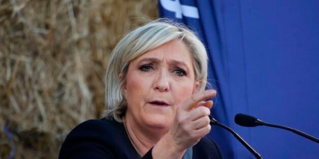 French presidential election candidate for the far-right Front National (FN) party Marine Le Pen gestures as she delivers a speech during a campaing rally at the Puybonnieux farm in Pageas, near Limoges, on April 13, 2017. / AFP PHOTO / PASCAL LACHENAUD (Photo credit should read PASCAL LACHENAUD/AFP/Getty Images)