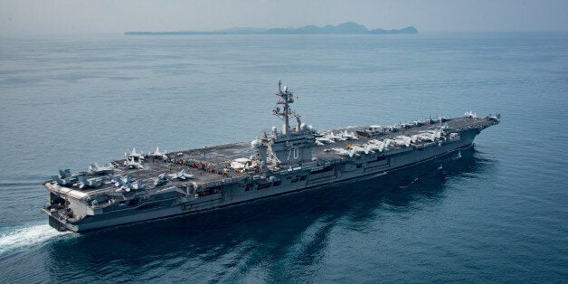 SUNDA STRAIT, INDONESIA - APRIL 14: In this handout provided by the U.S. Navy, the aircraft carrier USS Carl Vinson (CVN 70) transits the Sunda Strait on April 14, 2017 in Indonesia. The Carl Vinson Carrier Strike Group is on a scheduled western Pacific deployment as part of the U.S. Pacific Fleet-led initiative to extend the command and control functions of U.S. 3rd Fleet. U.S Navy aircraft carrier strike groups have patrolled the Indo-Asia-Pacific regularly and routinely for more than 70 years. (Photo by Mass Communication Specialist 2nd Class Sean M. Castellano / U.S. Navy via Getty Images)