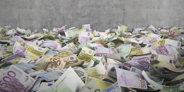 euro banknotes on a conctere wall background