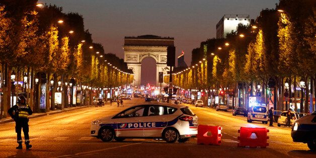 Police secure the Champs Elysee Avenue after one policeman was killed and another wounded in a shooting incident in Paris, France, April 20, 2017. REUTERS/Christian Hartmann