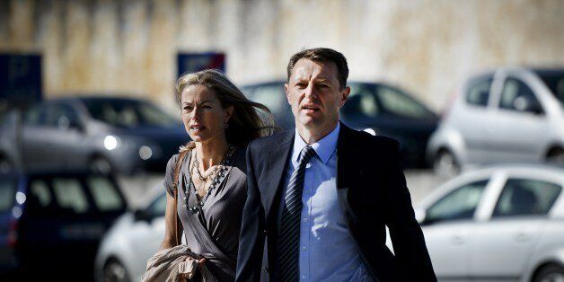 Britons Kate McCann (L) and her husband Gerry McCann (C), parents of missing British girl Madeleine McCann, arrive to the court house in Lisbon on June 16, 2014 for the closing arguments of the McCann couple's libel proceedings against former inspector Goncalo Amaral for a book written about the case of their missing daughter. Kate McCann and her husband Gerry are suing Amaral in a Lisbon court for the book in which he argues Madeleine was killed accidentally and implicates her parents in her al