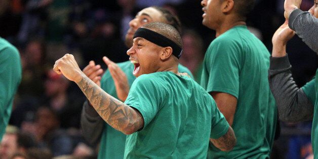 Apr 2, 2017; New York, NY, USA; Boston Celtics point guard Isaiah Thomas (4) cheers from the bench during...