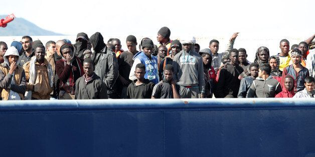 Men and women wait to disembark a navy which transports severals immigrants in the port of Messina, on the island of Sicily, on April 17, 2017 after a rescue operation of migrants and refugees in the Mediterranean sea. About 1260 refugees are saved in the mediterranean sea by the ship CC Panther. (Photo by Gabriele Maricchiolo/NurPhoto via Getty Images)