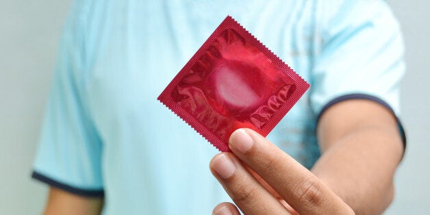 man holding condom