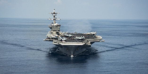 The aircraft carrier USS Carl Vinson transits the South China Sea while conducting flight operations on April 9, 2017. The Carl Vinson Carrier Strike Group is on a scheduled western Pacific deployment as part of the U.S. Pacific Fleet-led initiative to extend the command and control functions of U.S. 3rd Fleet. Picture taken on April 9, 2017 Z.A. Landers/Courtesy U.S. Navy/Handout via REUTERS ATTENTION EDITORS - THIS IMAGE WAS PROVIDED BY A THIRD PARTY. EDITORIAL USE ONLY.