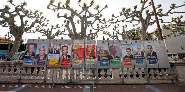 Campaign posters of the 11 candidates who run in the 2017 French presidential election are seen in Le Soler, near Perpignan, France April 15, 2017. (L-R) Debout La France group candidate Nicolas Dupont-Aignan, French National Front (FN) political party leader Marine Le Pen, head of the political movement En Marche! (Onwards!) Emmanuel Macron, French Socialist party candidate Benoit Hamon, France's extreme-left Lutte Ouvriere political party (LO) leader Nathalie Arthaud, Anti-Capitalist Party (NPA) presidential candidate Philippe Poutou,