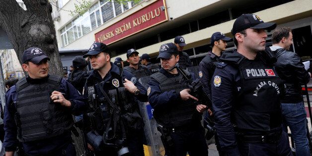 Riot police secure the entrance of the High Electoral Board as people wait in line to submit their personal appeals for annulment of the referendum, in Ankara, Turkey, April 18, 2017. REUTERS/Umit Bektas