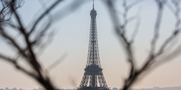 The Eiffel Tower stands as residential and commercial properties sit on the city skyline in Paris, France, on Friday, April 21, 2017. The murder of a policeman on the Champs-Elysees has forced an early end to campaigning for the leading candidates in France's presidential election as they head into Sundays first-round of voting with the race wide open. Photographer: Christophe Morin/Bloomberg via Getty Images