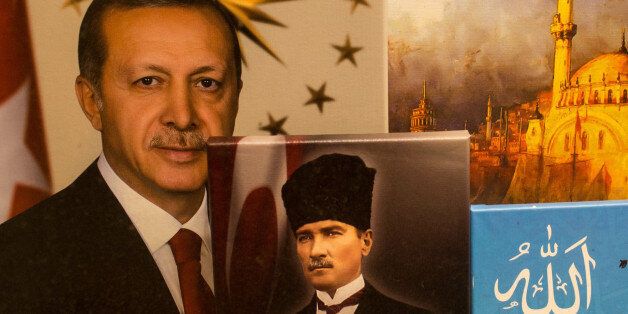 ISTANBUL, TURKEY - APRIL 15: Paintings of Turkish President Recep Tayyip Erdogan and the founder of modern Turkey Mustafa Kemal Ataturk are seen in a shop window on April 15, 2017 in Istanbul, Turkey. Posters, banners and flags have been taken down throughout the night ahead of tomorrow's vote. Campaigning by both the 'Evet'(Yes) and 'Hayir' (No) camps intensified across the country in the final day ahead of Turkey holding a constitutional referendum on April 16, 2017. Turks will vote on 18 pro