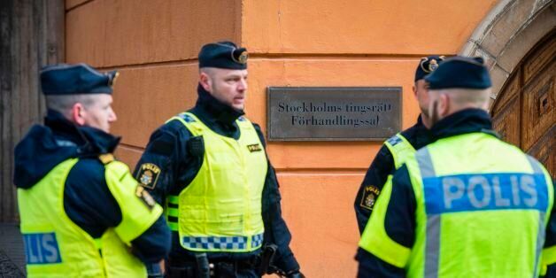 Policemen secure the entrance to the Stockholm District Court where Uzbek national Rakhmat Akilov (not in picture), prime suspect in the Stockholm truck attack, appeared in court on April 11, 2017.39-year-old Uzbek national Akilov suspected of mowing down a crowd of people on a busy Stockholm street in a stolen truck admitted committing 'a terrorist crime,' his lawyer said. / AFP PHOTO / Jonathan NACKSTRAND (Photo credit should read JONATHAN NACKSTRAND/AFP/Getty Images)