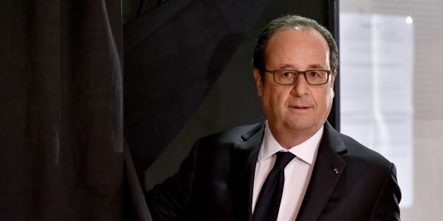 Outgoing French president Francois Hollande exits a voting booth before casting his ballot at a polling station in Tulle, central France, on April 23, 2017, during the first round of the Presidential election. / AFP PHOTO / POOL / GEORGES GOBET (Photo credit should read GEORGES GOBET/AFP/Getty Images)