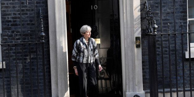 Britain's Prime Minister Theresa May walks out of 10 Downing Street to welcome the President of the European Parliament Antonio Tajani, in London, April 20, 2017. REUTERS/Toby Melville