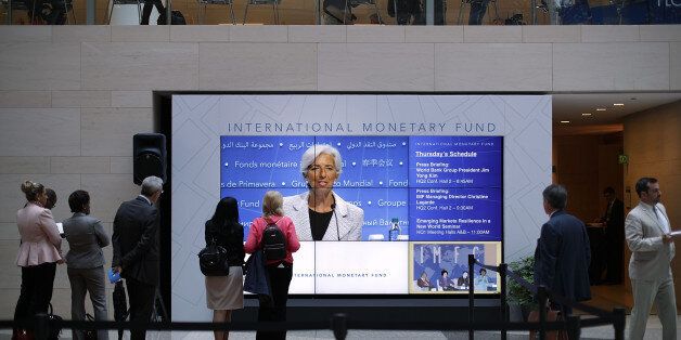 WASHINGTON, DC - APRIL 20: International Monetary Fund Managing Director Christine Lagarde appears on a video wall during a news conference at the World Bank and IMF Spring Meetings April 20, 2017 in Washington, DC. According to the IMF's World Economic Outlook, the global economy is projected to grow 3.5-percent in 2017, up from its previous forecast of 3.4-percent in January. (Photo by Chip Somodevilla/Getty Images)