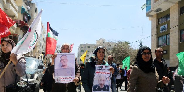 Hundreds of Palestinians rally demanding the release of the Palestinian prisoners in Israeli jails during the Palestinian Prisoners Day in Gaza city, on April 17, 2017. (Photo by Momen Faiz/NurPhoto via Getty Images)