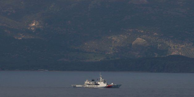 The Turkish shore is seen in the background as a Turkish coast guard vessel takes part in an operation after an inflatable boat carrying refugees and migrants sank and at least 15 people drowned, on the island of Lesbos, Greece April 24, 2017. Picture taken from the island of Lesbos. REUTERS/Elias Marcou