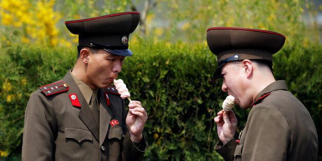Soldiers enjoy ice-cream in Pyongyang, North Korea April 16, 2017. REUTERS/Damir Sagolj