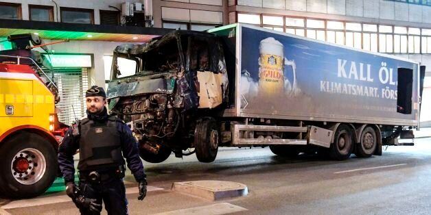 This picture taken on April 8, 2017, shows the truck that crashed into the Ahlens department store at Drottninggatan in central Stockholm the day before.Swedish police said on April 8, 2017, that a man arrested on 'suspicion of terrorist crime' could be the driver of the truck that ploughed into a crowd of people in a busy Stockholm store department. Sweden had strengthened border controls after an unidentified attacker ploughed a truck through a crowd into a department store in central Stockholm, killing four people and injuring 15. / AFP PHOTO / TT NEWS AGENCY / Maja SUSLIN / Sweden OUT (Photo credit should read MAJA SUSLIN/AFP/Getty Images)