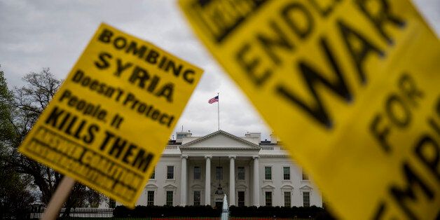 WASHINGTON, DC - APRIL 07: Demonstrators gather outside the White House to protest the recent U.S. missile strike in Syria April 7, 2017 in Washington, DC. The United States has launched a missile strike in Syria after reports that Syrian President Bashar al-Assad allegedly used nerve agent sarin gas in a recent attack in his own country. (Photo by Eric Thayer/Getty Images)