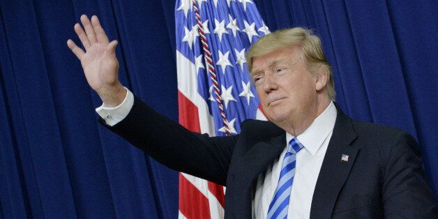 U.S. President Donald Trump waves during a town hall meeting with executives on the America business climate in the South Court Auditorium of the White House in Washington, D.C., U.S., on Tuesday, April 4, 2017. TrumpÂ has vowed to flatten regulatory hurdles for American business, and Congress's proposed EPA rules for science would make commerce easier. Photographer: Olivier Douliery/Bloomberg via Getty Images