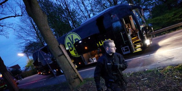 Football Soccer - Borussia Dortmund v AS Monaco - UEFA Champions League Quarter Final First Leg - Signal Iduna Park, Dortmund, Germany - 11/4/17 Police with the Borussia Dortmund team bus after an explosion near their hotel before the game Reuters / Kai Pfaffenbach Livepic TPX IMAGES OF THE DAY