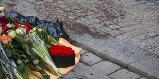STOCKHOLM, SWEDEN - APRIL 08: Dried blood remains on the pavement on Drottninggatan at the scene of the terrorist truck attack in downtown of the city where sympathy flowers are being left on April 8, 2017 in Stockholm, Sweden. The attack where a hijacked truck crashed into the front of Ahlens department store killed four people and injured another 15. (Photo by Michael Campanella/Getty Images)
