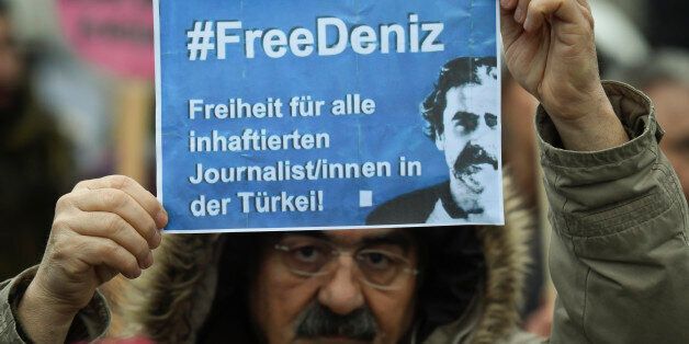 A protester demands the release of jailed Turkish-German journalist Deniz Yucel in Hamburg, Germany March 7, 2017. REUTERS/Fabian Bimmer