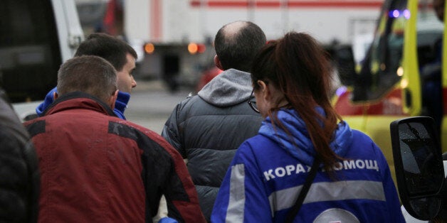 REFILE - QUALITY REPEATAn injured person is helped by emergency services outside Sennaya Ploshchad metro station, following explosions in two train carriages at metro stations in St. Petersburg, Russia April 3, 2017. REUTERS/Anton Vaganov