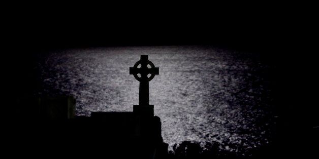 A silhouette of a cross by moonlight in the seaside cemetery at Clovelly in Sydney. Sydney, Australia. Wednesday, 6th May 2015 (Photo: Steve Christo) (Photo by Steve Christo/Corbis via Getty Images)