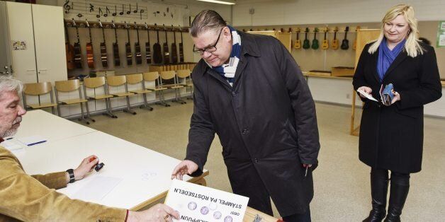 Finland's Foreign Minister and the True Finns party chairman Timo Soini and his wife Tiina Soini (R) cast their votes in the Finnish municipal elections in Espoo, Finland on April 9, 2017.Finns went to polls to vote for their municipal delegates. / AFP PHOTO / Lehtikuva / Roni Rekomaa / Finland OUT (Photo credit should read RONI REKOMAA/AFP/Getty Images)