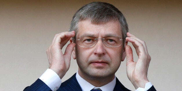 Russian president of AS Monaco football club, Dmitri Rybolovlev gestures at the start of a French L2 football match Monaco vs Caen on May 4, 2013 at the Louis II stadium in Monaco. AFP PHOTO / VALERY HACHE (Photo credit should read VALERY HACHE/AFP/Getty Images)