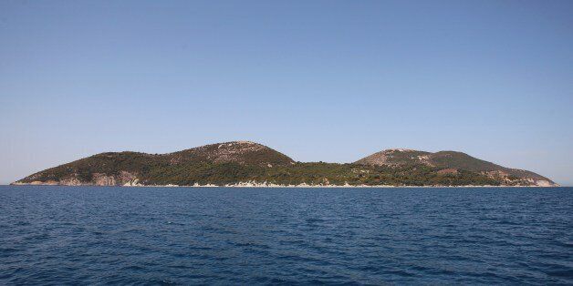 TO GO WITH AFP STORY BY BRISEIDA MEMA A picture taken on July 31, 2015 shows a general view of the island of Sazan, some 140 km southwest of Albania's capital Tirana, on July 31, 2015. Once communist Albania's most secret military base, a 'sentinel' of the Adriatic Sea, the Sazan island has opened to tourists its bunkers and tunnels amid wildness that authorities hope to turn into an attraction. AFP PHOTO / GENT SHKULLAKU (Photo credit should read GENT SHKULLAKU/AFP/Getty Images)