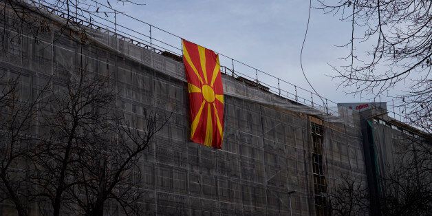 SKOPJE, MACEDONIA - MARCH 05: A large Macedonian flag hangs on a building under construction on March 5, 2017 in Skopje, Macedonia. The political crisis has deepened after the president refused to grant Socialist Democrats a mandate to form a government with the Albanian parties. European and NATO officials asked the president to give a mandate to the parliamentarian majority formed by the Socialist Democrats and Albanian parties. Russia has given its support to the right wing nationalist party VMRO-DPMNE. (Photo by Pierre Crom/Getty Images)
