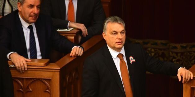 Hungarian Prime Minister Viktor Orban (R) waits for the result of the presidential election at the Hungarian Parliament in Budapest on March 13, 2017. / AFP PHOTO / ATTILA KISBENEDEK (Photo credit should read ATTILA KISBENEDEK/AFP/Getty Images)