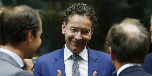 Dutch Finance Minister and Eurogroup President Jeroen Dijsselbloem (C) gestures during a euro zone finance ministers meeting in Brussels, Belgium, July 11, 2015. Greek Prime Minister Alexis Tsipras won backing from lawmakers on Saturday for painful reforms but it remained unclear whether it would be enough to secure a bailout from German and other euro zone ministers meeting in Brussels. REUTERS/Francois Lenoir