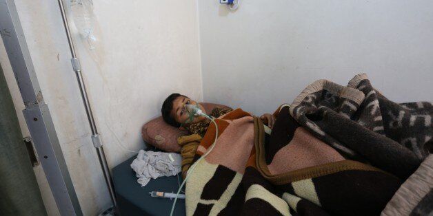 IDLIB, SYRIA - APRIL 05: A chemical gas attack survivor 9-years-old boy, Hassan Dallal, receives medical treatment at an hospital Maarrat al-Nu'man Town of Idlib, Syria on April 05, 2017. On Tuesday more than 100 civilians had been killed and 500 others, mostly children, injured in Assad Regime's suspected chlorine gas attack carried out by warplanes in the town of Khan Shaykun, Idlib province. (Photo by Mohammed Karkas/Anadolu Agency/Getty Images)
