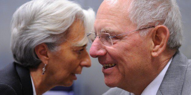 French Finance Minister Christine Lagarde (L) sits next to German Finance Minister Wolfgang Schaeuble on June 20, 2011 before a meeting of eurozone finance ministers at EU headquarters in Luxembourg. Europe promised on June 20 to unblock existing bailout loans for Greece and draw up a second financial rescue as long as its parliament approves fierce new budget cuts and a raft of asset sales. AFP PHOTO / GEORGES GOBET (Photo credit should read GEORGES GOBET/AFP/Getty Images)