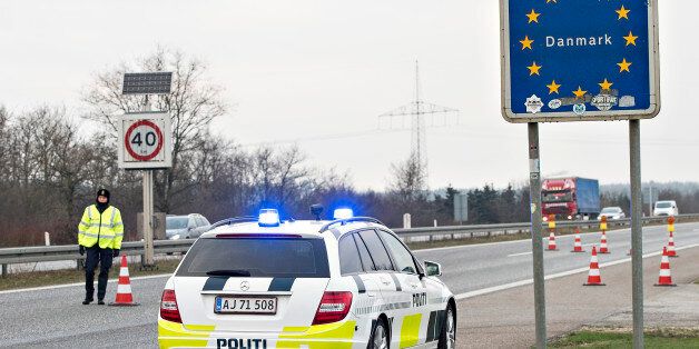 Danish Police officers check vehicles at the bordertown of Padborg, Denmark January 4, 2016. Denmark imposed temporary identity checks on its border with Germany on Monday following a similar move by Sweden, dealing a double blow to Europe's fraying passport-free Schengen area amid a record influx of migrants. REUTERS/Claus Fisker/Scanpix Denmark ATTENTION EDITORS - THIS IMAGE WAS PROVIDED BY A THIRD PARTY. FOR EDITORIAL USE ONLY. NOT FOR SALE FOR MARKETING OR ADVERTISING CAMPAIGNS. THIS PICTURE IS DISTRIBUTED EXACTLY AS RECEIVED BY REUTERS, AS A SERVICE TO CLIENTS. DENMARK OUT. NO COMMERCIAL OR EDITORIAL SALES IN DENMARK. NO COMMERCIAL SALES.