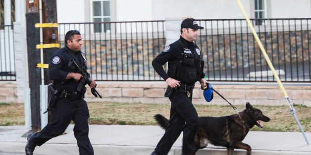 Shooting in San Bernardino. San Bernardino Police Department officers searching for more possible shooters after two shooters just engaged them to the north. (Photo by Ted Soqui/Corbis via Getty Images)