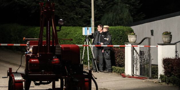 DORTMUND, GERMANY - APRIL 12: Police investigates on April 12, 2017 in Dortmund, Germany, near the team hotel after the bus of Borussia Dortmund was also damaged in explosions that happened before the Champions League game against Monaco. According to police an explosion detonated as the bus was leaving the hotel where the team was staying. So far one person, team member Marc Bartra, is reported injured. (Photo by Maja Hitij/Getty Images)