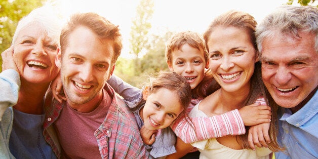 Multi-generation family having fun together outdoors