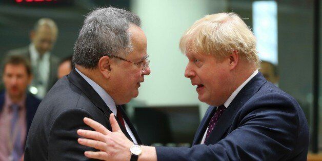 BRUSSELS, BELGIUM - FEBRUARY 06: British Foreign Secretary Boris Johnson (R) and Greek Foreign Minister Nikos Kotzias (L) attend the Foreign Affairs ministers meeting at the EU headquarters in Brussels, Belgium on February 06, 2017. (Photo by Dursun Aydemir/Anadolu Agency/Getty Images)