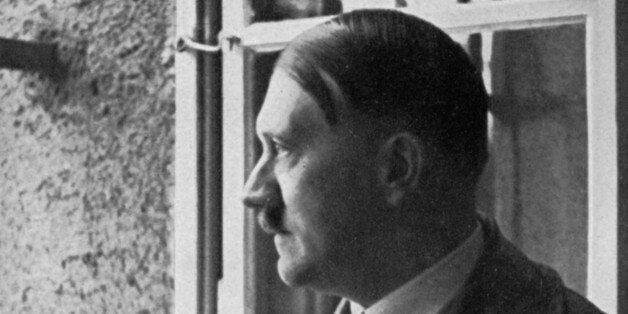 Adolf Hitler looks out of his cell window at Landsberg Fortress, Bavaria, Germany, 1934. Hitler (1889-1945) visiting the prison where he spent 8 months in 1924 for his part in the Munich Beer Hall Putsch, the failed attempt by the Nazis to seize power in Germany on 9 November 1923. A print from Adolf Hitler. Bilder aus dem Leben des FÃ¼hrers, Hamburg: Cigaretten/Bilderdienst Hamburg/Bahrenfeld, 1936. (Photo by The Print Collector/Print Collector/Getty Images)