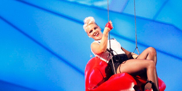 Singer Pink is suspended in the air as she performs during the 2012 MTV Video Music Awards in Los Angeles, September 6, 2012. REUTERS/Mario Anzuoni (UNITED STATES - Tags: ENTERTAINMENT) (MTV-SHOW)